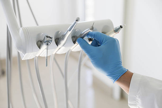 Professional Tooth Extraction technician working in Garland, TX